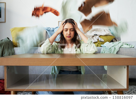 Headache, stress and woman with anxiety for laundry, clothes or overwhelmed by cleaning task. Housework, burnout and lady with migraine for washing, pile or chaos at home with vertigo or brain fog 138816097