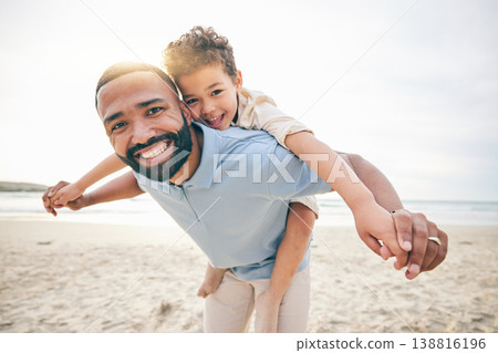 Father, son and piggyback, beach and portrait with love and bonding, travel and ocean with holiday, fun and happiness. Playful, smile and trust, man and boy together with vacation and sea adventure Father, son and piggyback, beach and portrait with love and bonding, travel and ocean with holiday, fun and happiness. Playful, smile and trust, man and boy together with vacation and sea adventure 138816196