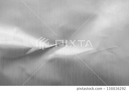 Shiny metal silver gray foil leaf crumpled texture background 138816292