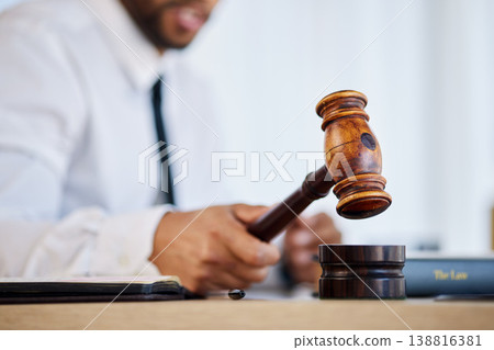 Hand, gavel and a man judge in court for order at a verdict in a criminal case or trial closeup. Justice, law or legal with a magistrate hammer in a courtroom for a hearing of evidence or legislation Hand, gavel and a man judge in court for order at a verdict in a criminal case or trial closeup. Justice, law or legal with a magistrate hammer in a courtroom for a hearing of evidence or legislation 138816381