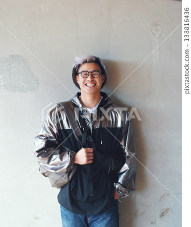 Portrait, fashion and Asian man with a smile, streetwear and stylish outfit against a wall background. Male person, happy model and student with glasses, trendy clothes and happiness with confidence Portrait, fashion and Asian man with a smile, streetwear and stylish outfit against a wall background. Male person, happy model and student with glasses, trendy clothes and happiness with confidence 138816436