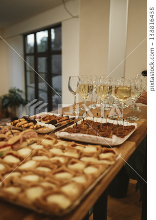Elegant Buffet Table with Wine and Appetizers Displayed Elegant Buffet Table with Wine and Appetizers Displayed 138816438