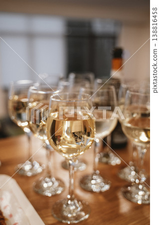 Glasses of White Wine on Wooden Table at Celebration Glasses of White Wine on Wooden Table at Celebration 138816458