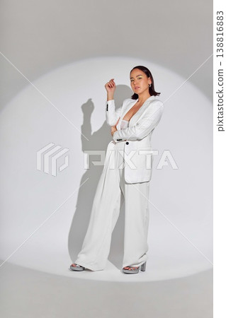 Luxury, portrait and fashion with spotlight on woman in studio for makeup, creative and art. Design, glamour and cosmetics with face of person on white background for elegant, trendy and beauty Luxury, portrait and fashion with spotlight on woman in studio for makeup, creative and art. Design, glamour and cosmetics with face of person on white background for elegant, trendy and beauty 138816883