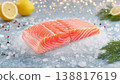 Salmon fillet rests on a blue kitchen counter. Bright bokeh lights around the dish. 138817619