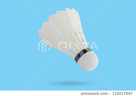 Badminton shuttlecock floating on blue background 138817687