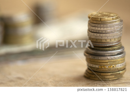 Stacks of international coins and banknotes on wooden table for finance 138817821