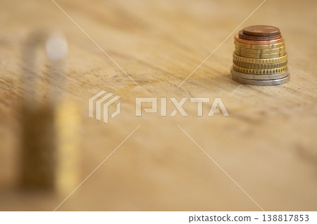 Financial protection concept with coins stack and blurred padlock Financial protection concept with coins stack and blurred padlock 138817853