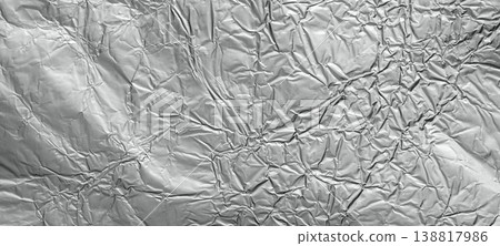 Shiny metal silver gray foil leaf crumpled texture background 138817986