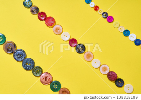 Minimal diagonal button pattern on yellow background Minimal diagonal button pattern on yellow background 138818199