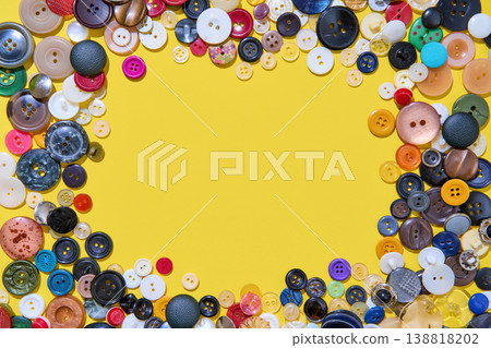 Colorful button border frame with copy space on yellow background Colorful button border frame with copy space on yellow background 138818202