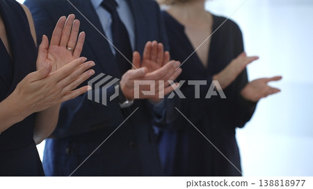 Business people are clapping hands, expressing gratitude and acknowledging a successful performance or presentation, creating a positive and encouraging atmosphere in a professional setting Business people are clapping hands, expressing gratitude and acknowledging a successful performance or presentation, creating a positive and encouraging atmosphere in a professional setting 138818977