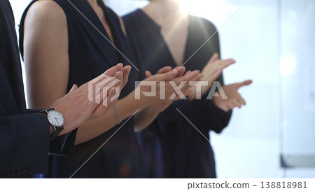 Group of business people clapping hands celebrating achievement, showing appreciation and support during a corporate meeting or seminar at a bright office conference Group of business people clapping hands celebrating achievement, showing appreciation and support during a corporate meeting or seminar at a bright office conference 138818981