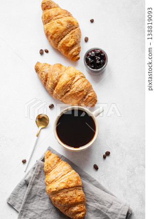 Cup of espresso coffee and fresh croissants on a light textured background with berry jam Cup of espresso coffee and fresh croissants on a light textured background with berry jam 138819093