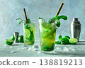 Mojito, summer cocktail with mint, lime, and ice, side view of two glasses 138819213