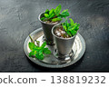 Mint Julep in the Kentucky Derby classic silver glass, with fresh mint leaves 138819232