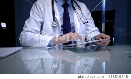 Doctor working with modern digital tablet, embracing telehealth, telemedicine, and healthcare technology for patient data management and electronic medical records 138819248