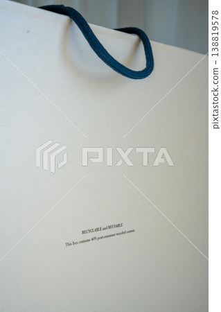 Close up of recyclable and reusable packaging label on eco friendly box with copy space. Sustainable materials and environmental responsibility concept. 138819578