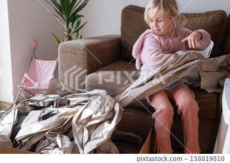 Excited 4 year old girl unboxing a huge delivery parcel at home Excited 4 year old girl unboxing a huge delivery parcel at home 138819810