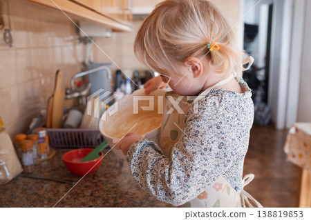 Independent preschooler: little 4 year old girl baking a homemade pie alone in a cozy kitchen 138819853