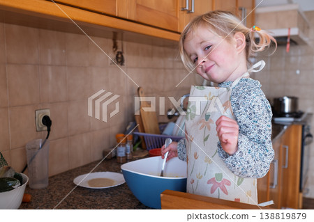 Independent preschooler: little 4 year old girl baking a homemade pie alone in a cozy kitchen Independent preschooler: little 4 year old girl baking a homemade pie alone in a cozy kitchen 138819879