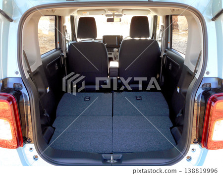 Luggage space in a kei car with the rear seats folded down. Luggage space in a kei car with the rear seats folded down. 138819996