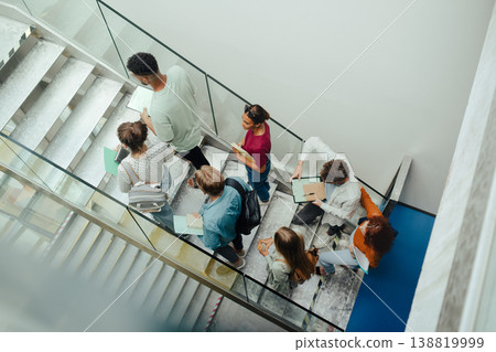 Group of university students walking up stairs, back to school concept. Group of university students walking up stairs, back to school concept. 138819999