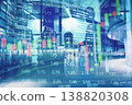 City finance scene shows people walking past large buildings with stock market data overlay on a busy city street in the evening 138820308