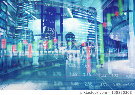 City finance scene shows people walking past large buildings with stock market data overlay on a busy city street in the evening City finance scene shows people walking past large buildings with stock market data overlay on a busy city street in the evening 138820308