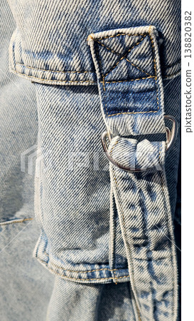 Pocket with a fastener on a stonewashed jeans 138820382
