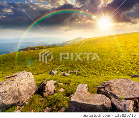 sunset over mountain summer landscape. meadow with giant stones among the grass on the hillside. awe view near the peak of mountain smooth in evening dappled light. great outdoors. weather with sunset over mountain summer landscape. meadow with giant stones among the grass on the hillside. awe view near the peak of mountain smooth in evening dappled light. great outdoors. weather with 138820710