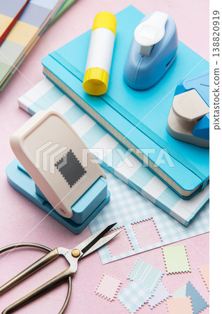 Crafting materials with paper punches and colorful notebooks Crafting materials with paper punches and colorful notebooks 138820919
