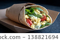 Delicious Breakfast Wrap with Scrambled Eggs, Avocado, and Tomato 138821694