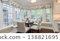 Cozy Breakfast Nook with Floral Touches and Natural Light. 138821695