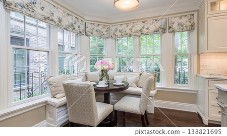 Cozy Breakfast Nook with Floral Touches and Natural Light. 138821695