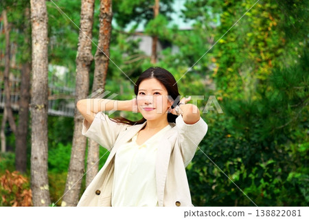 Office ladies refresh themselves amidst lush greenery, showcasing work-life balance and a tranquil landscape. Office ladies refresh themselves amidst lush greenery, showcasing work-life balance and a tranquil landscape. 138822081