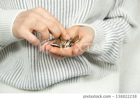 Hands count change. The concept of money and saving 138822238