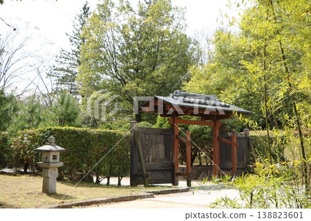 The entrance to the garden, surrounded by fresh greenery. 138823601