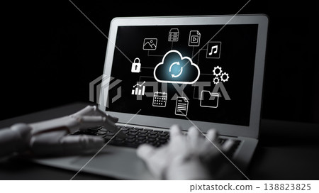 Modern technology concept with robotic hand interacting with laptop displaying cloud computing icons and digital data connectivity symbols Gantry 138823825