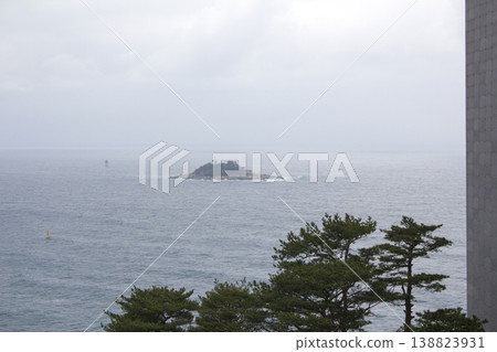 It is a seascape with a small island. 138823931