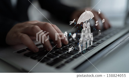 Hands typing on a laptop with digital icons representing family protection and insurance services, highlighting modern technology role in securing future safety and wellbeing. Sigmoid Hands typing on a laptop with digital icons representing family protection and insurance services, highlighting modern technology role in securing future safety and wellbeing. Sigmoid 138824055