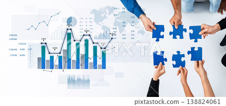 Diverse hands collaborating with blue puzzle pieces over a financial graph and statistical data, symbolizing teamwork and business growth strategies across regions Scalp 138824061
