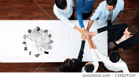 Diverse Team Collaborating on Project with Global Icons on Table, Symbolizing Teamwork and Innovation for Business Solutions and Strategies Trope 138824105