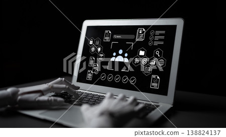 Digital Innovation in Artificial Intelligence with Robotic Hand Interacting with Laptop Displaying Technology Graphics on Black Background Gantry 138824137