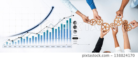 Collaborative hands holding gears above a business graph displaying growth trends and statistics, symbolizing teamwork and innovation in the corporate environment Scalp Collaborative hands holding gears above a business graph displaying growth trends and statistics, symbolizing teamwork and innovation in the corporate environment Scalp 138824170