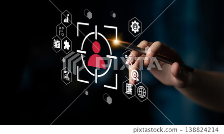Modern technology concept with hand holding pen, targeting user profile with digital analytics icons in a dark background setting for innovative solutions Gantry Modern technology concept with hand holding pen, targeting user profile with digital analytics icons in a dark background setting for innovative solutions Gantry 138824214