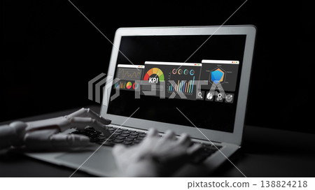 Robotic Hand Operating Laptop Displaying Data Analytics and KPI Metrics in Dark Environment for Technology and Innovation Concepts Ledger Robotic Hand Operating Laptop Displaying Data Analytics and KPI Metrics in Dark Environment for Technology and Innovation Concepts Ledger 138824218