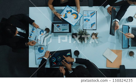 Top view of business people discussing about financial strategy. Directorate. Top view of business people discussing about financial strategy. Directorate. 138824235