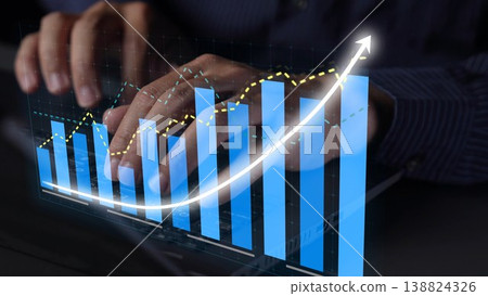 Hands Typing on a Keyboard with Digital Graph Overlay Showing Growth Trend and Data Analysis in a Modern Office Environment Copula Hands Typing on a Keyboard with Digital Graph Overlay Showing Growth Trend and Data Analysis in a Modern Office Environment Copula 138824326
