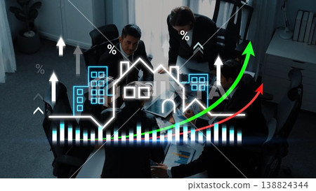 Business team analyzing real estate trends with growth charts and graphs in a modern office setting during meeting with collaborative discussions Gluon 138824344